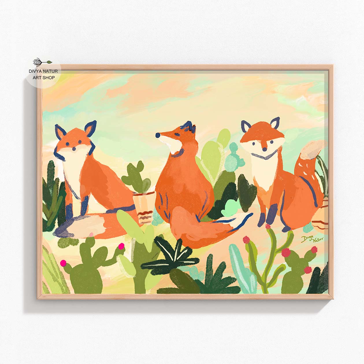 Playful trio of foxes in a desert landscape, filled with vibrant plants and cacti.