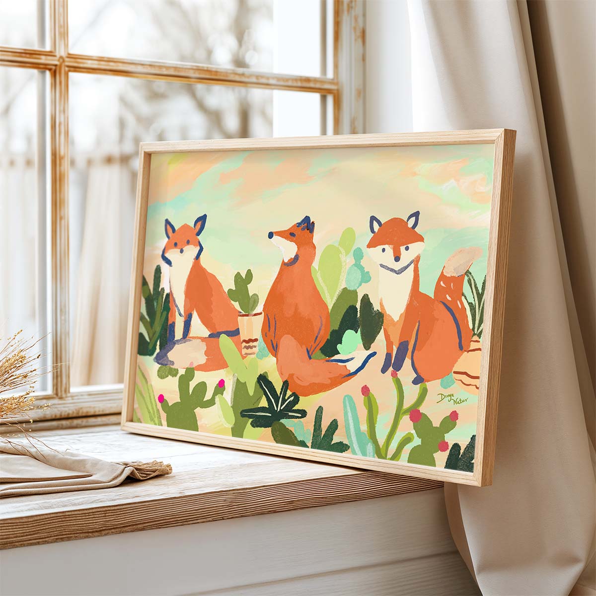 Three orange foxes in a desert scene with green cacti and a pastel sky background, ideal for nursery or general decor