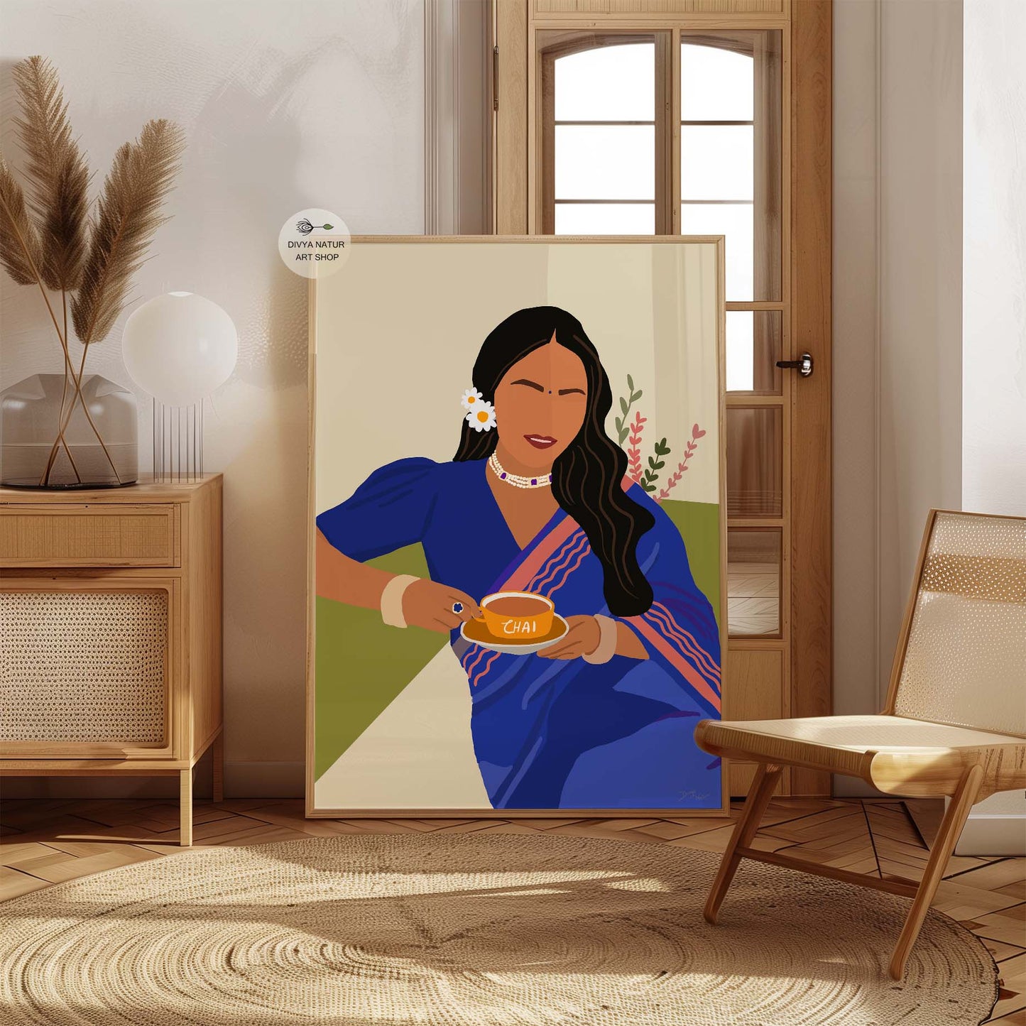 Woman in a blue saree with chai, ideal for chai enthusiasts.